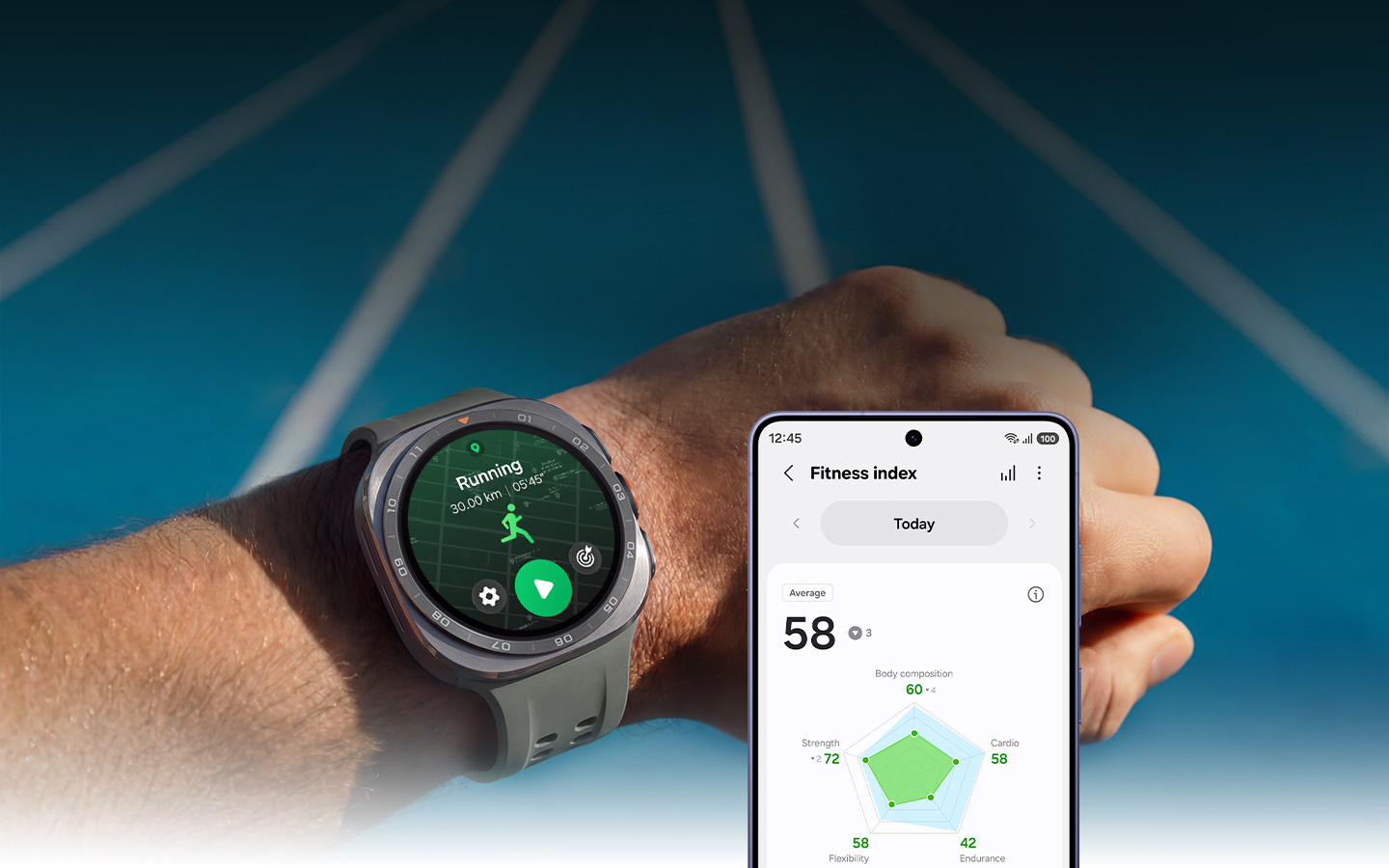 A wrist with Galaxy Watch Ultra2 held up in the bright sunlight. The Running feature is onscreen. Galaxy S26 displaying the Fitness Index feature is next to Galaxy Watch Ultra2, showing today's average fitness score, which is 58.