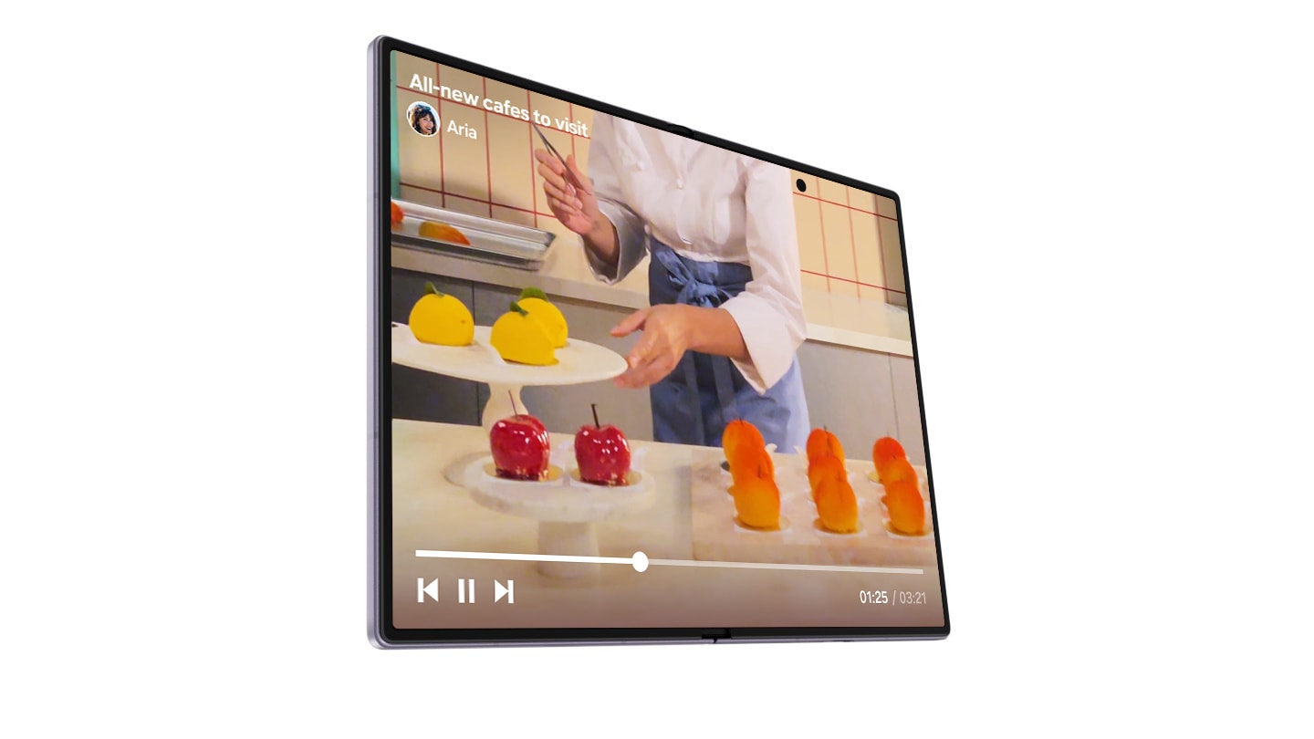 A folded Galaxy Z Fold8 in Lavender is seen from the cover screen displaying a social media post about cake shops. Scroll down the cover screen to see more social media posts about cakes. Close-up on the Galaxy Z Fold8 as it unfolds to play the video in the last social post on the expansive main screen.